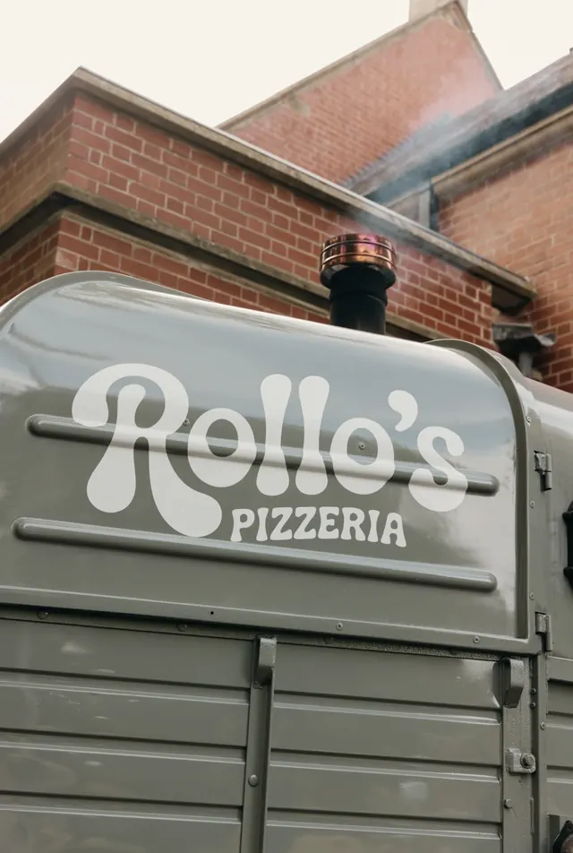 The Rollo's logo on the horsebox with smoke from the flue