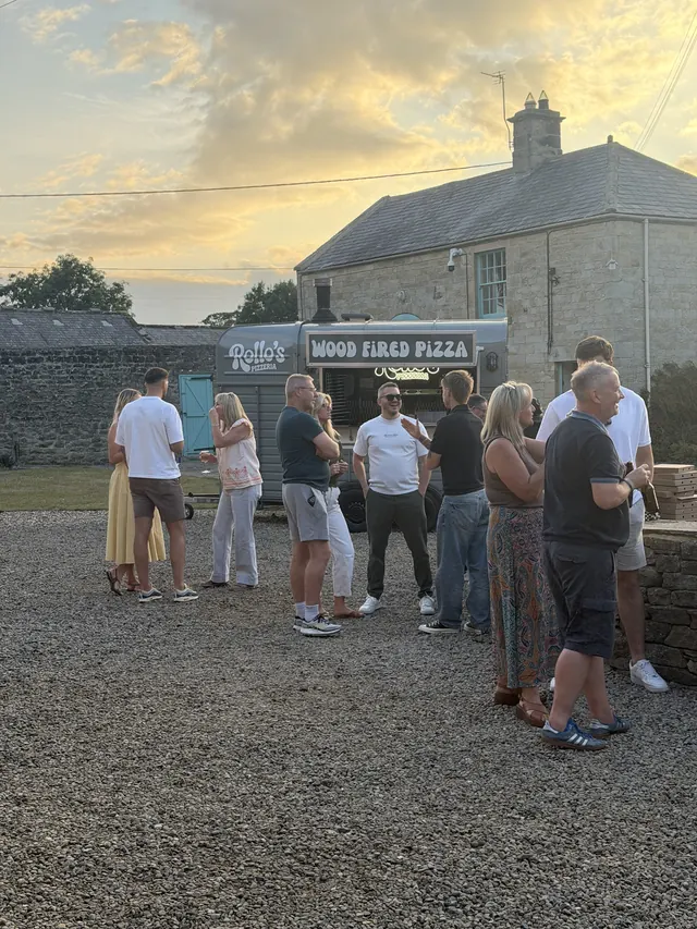 Guests at a private party with the horsebox at sunset